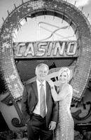 Couple photographed among vintage neon signs at the Neon Museum in Las Vegas
