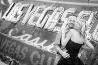 Couple photographed among vintage neon signs at the Neon Museum in Las Vegas