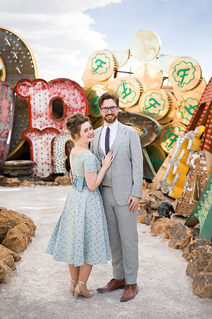 Couple photographed among vintage neon signs at the Neon Museum in Las Vegas