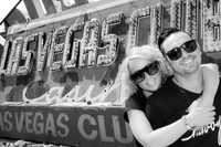 Couple photographed among vintage neon signs at the Neon Museum in Las Vegas