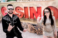 Couple photographed among vintage neon signs at the Neon Museum in Las Vegas