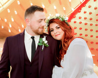 Couple photographed among vintage neon signs at the Neon Museum in Las Vegas