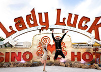 Couple photographed among vintage neon signs at the Neon Museum in Las Vegas
