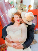 Couple photographed among vintage neon signs at the Neon Museum in Las Vegas
