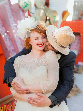 Couple photographed among vintage neon signs at the Neon Museum in Las Vegas