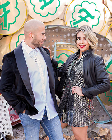 Couple photographed among vintage neon signs at the Neon Museum in Las Vegas