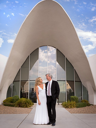 Couple photographed among vintage neon signs at the Neon Museum in Las Vegas