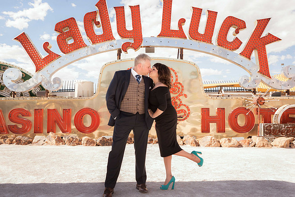 Couple photographed among vintage neon signs at the Neon Museum in Las Vegas