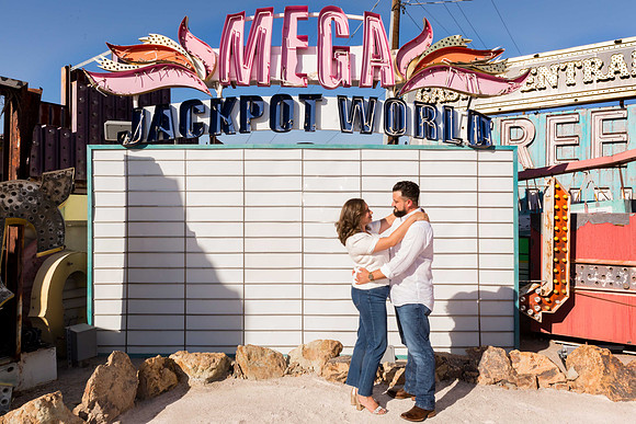 Couple photographed among vintage neon signs at the Neon Museum in Las Vegas