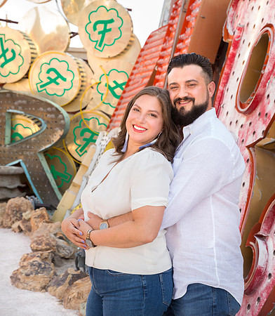 Couple photographed among vintage neon signs at the Neon Museum in Las Vegas