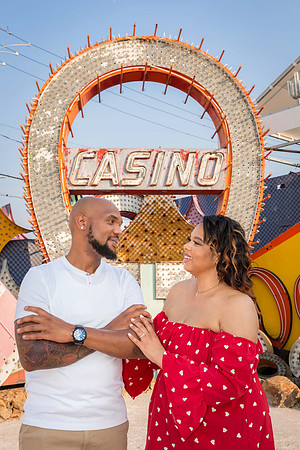 Couple photographed among vintage neon signs at the Neon Museum in Las Vegas