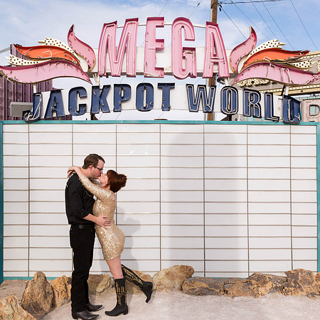 Couple photographed among vintage neon signs at the Neon Museum in Las Vegas
