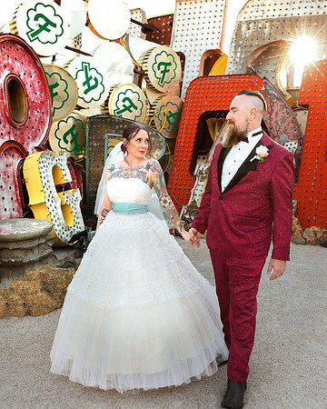 Couple photographed among vintage neon signs at the Neon Museum in Las Vegas