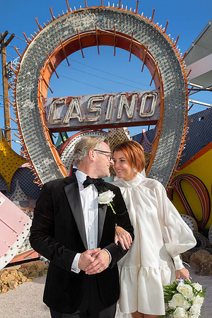 Couple photographed among vintage neon signs at the Neon Museum in Las Vegas