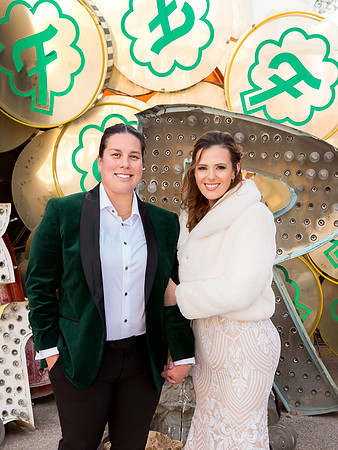 Couple photographed among vintage neon signs at the Neon Museum in Las Vegas