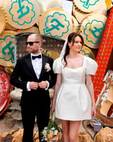 Couple photographed among vintage neon signs at the Neon Museum in Las Vegas