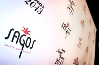Guests posing on a red carpet in front of a step and repeat backdrop in Las Vegas