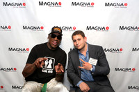 Guests posing on a red carpet in front of a step and repeat backdrop in Las Vegas