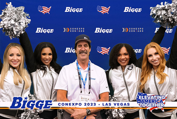 Guests posing on a red carpet in front of a step and repeat backdrop in Las Vegas