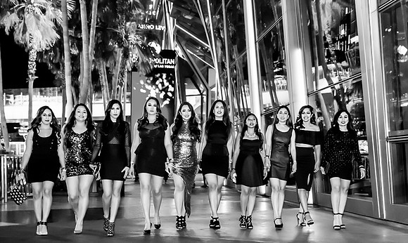 Friends posing together during a bachelorette photo shoot on the Las Vegas Strip