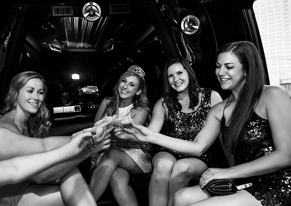 Friends posing together during a bachelorette photo shoot on the Las Vegas Strip