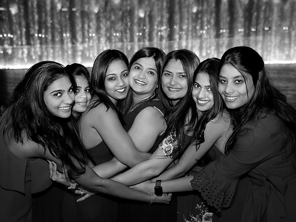Friends posing together during a bachelorette photo shoot on the Las Vegas Strip