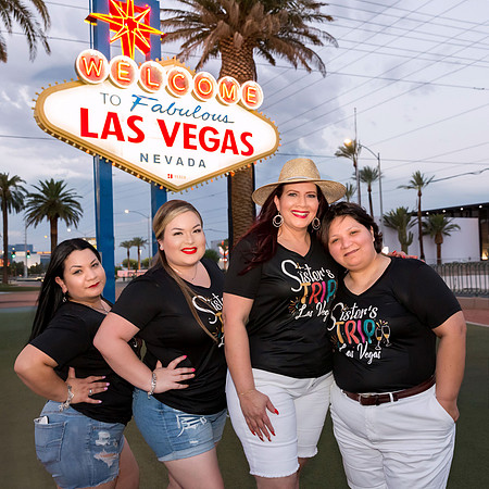Friends posing together during a bachelorette photo shoot on the Las Vegas Strip