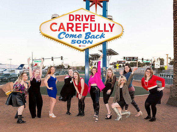 Friends posing together during a bachelorette photo shoot on the Las Vegas Strip