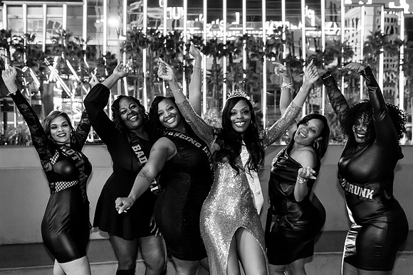 Friends posing together during a bachelorette photo shoot on the Las Vegas Strip