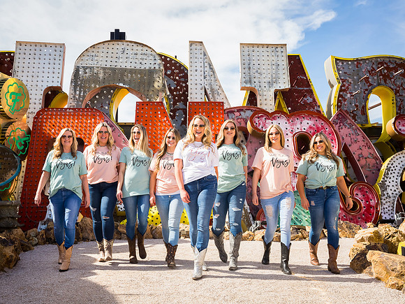 Friends posing together during a bachelorette photo shoot on the Las Vegas Strip