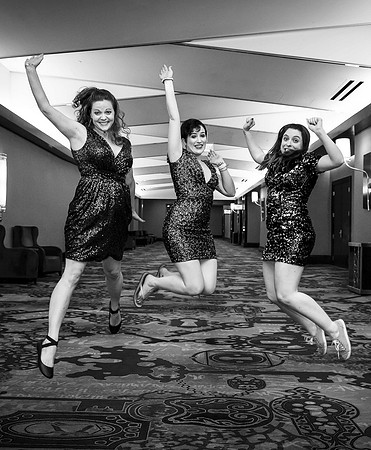 Friends posing together during a bachelorette photo shoot on the Las Vegas Strip
