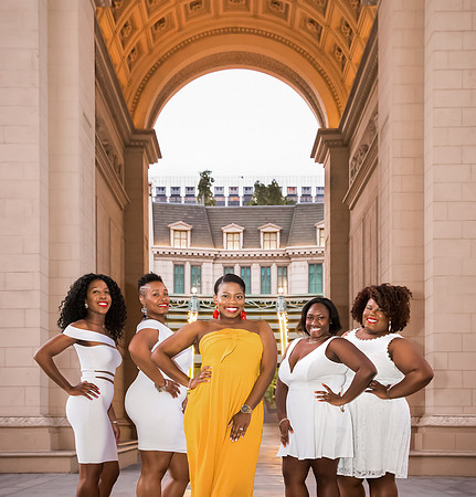 Friends posing together during a bachelorette photo shoot on the Las Vegas Strip