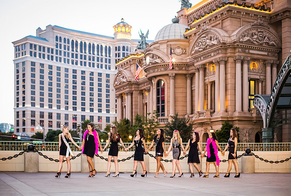 Friends posing together during a bachelorette photo shoot on the Las Vegas Strip