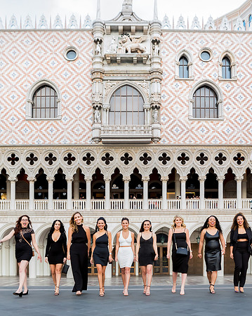 Friends posing together during a bachelorette photo shoot on the Las Vegas Strip