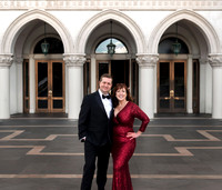 Couple dressed formally outside The Venetian during a Las Vegas anniversary photography session.