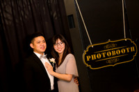 Guests posing in a photo booth with props at a Las Vegas event